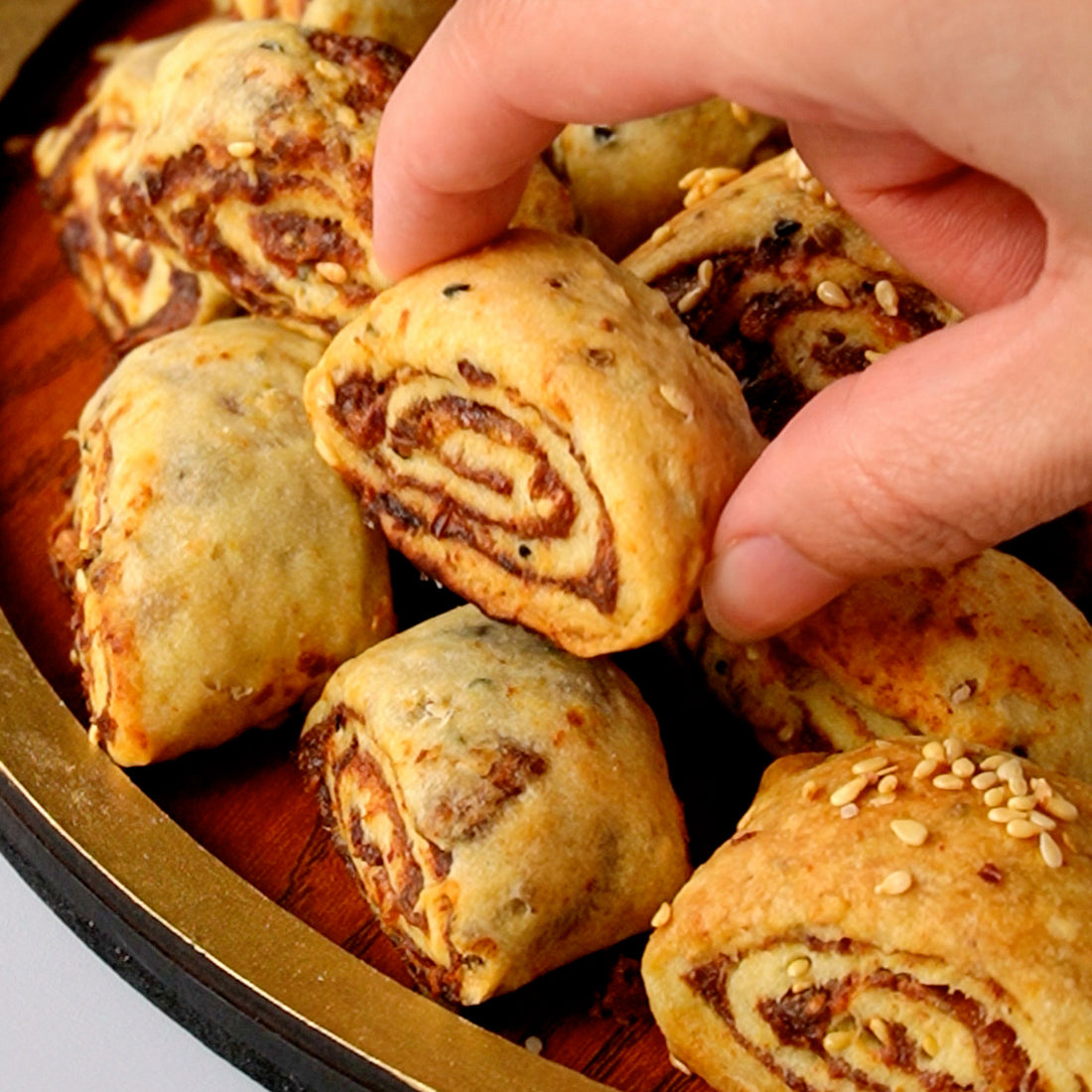 Palestinian Makrouta filled with Gazelle Medjool dates, golden-brown and served fresh from the oven.