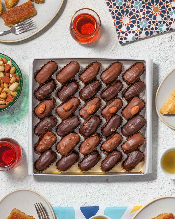 30-piece assortment of premium Belgian chocolate Medjool dates with unique fillings in a gift tin