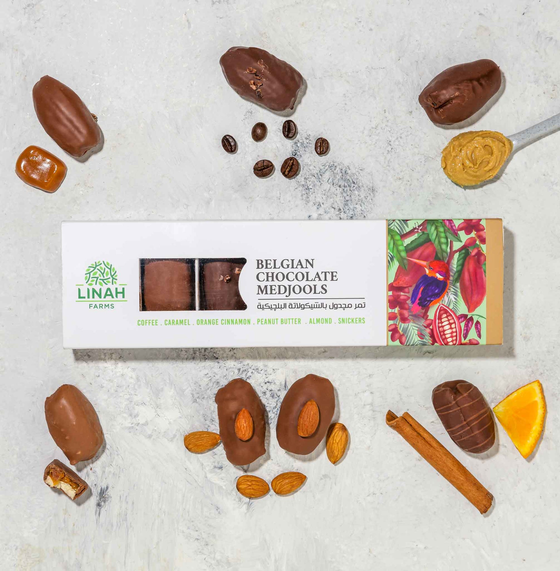 7-piece pack of Belgian chocolate-covered Medjool dates with assorted fillings: coffee, caramel, orange-cinnamon, peanut butter, almond, and Snickers displayed all ariund the pack